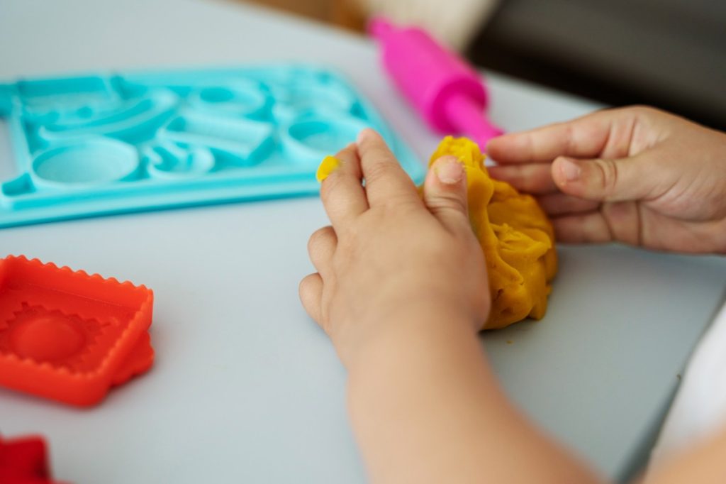 Easy, play-based fine motor activities for ages 3–5 that build hand strength, scissor skills, and pre-writing control—no worksheets needed.
